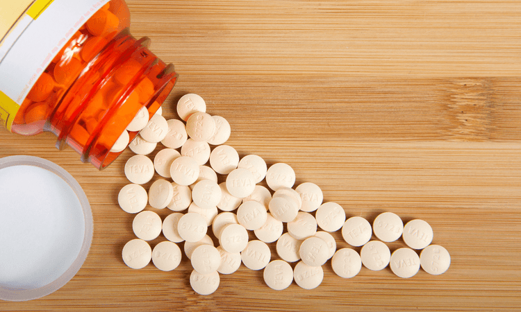 Pepcid spills on a wooden table