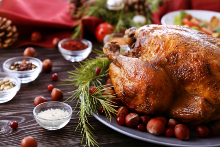 A turkey on a plate with nuts and spices Description automatically generated