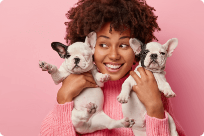 Woman hugging puppies